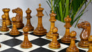 Ebony and antiqued chess pieces with a 103mm king and weighted felted bases