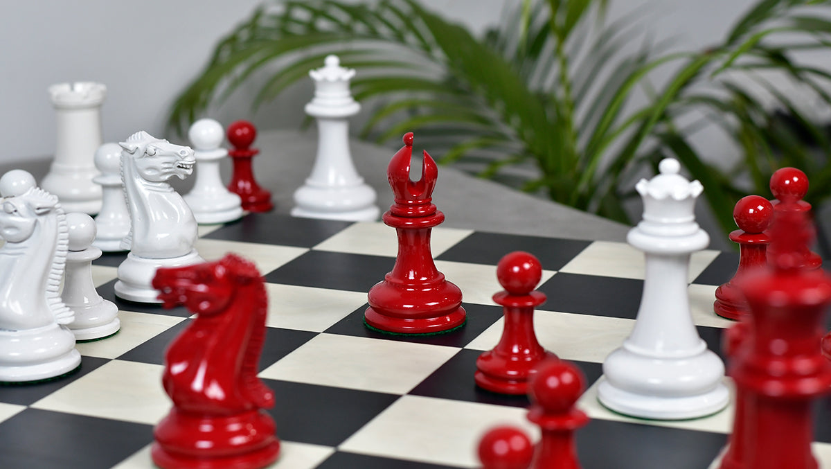 Painted crimson chess pieces with a 115mm king and weighted felted bases