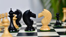 Hand carved knight detail on the 1950s Soviet Latvian Ebonised & Natural chess pieces
