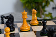 Staunton pattern chess pieces in ebonised and antique boxwood, 1972 set