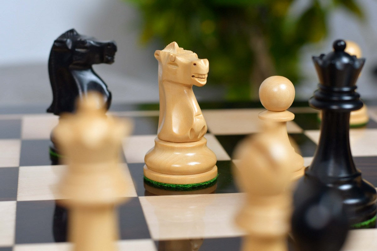 Staunton pattern chess pieces in ebonised and natural boxwood, 1972 set