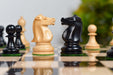 Ebonised and natural boxwood Staunton chess pieces, 3.77 inch king