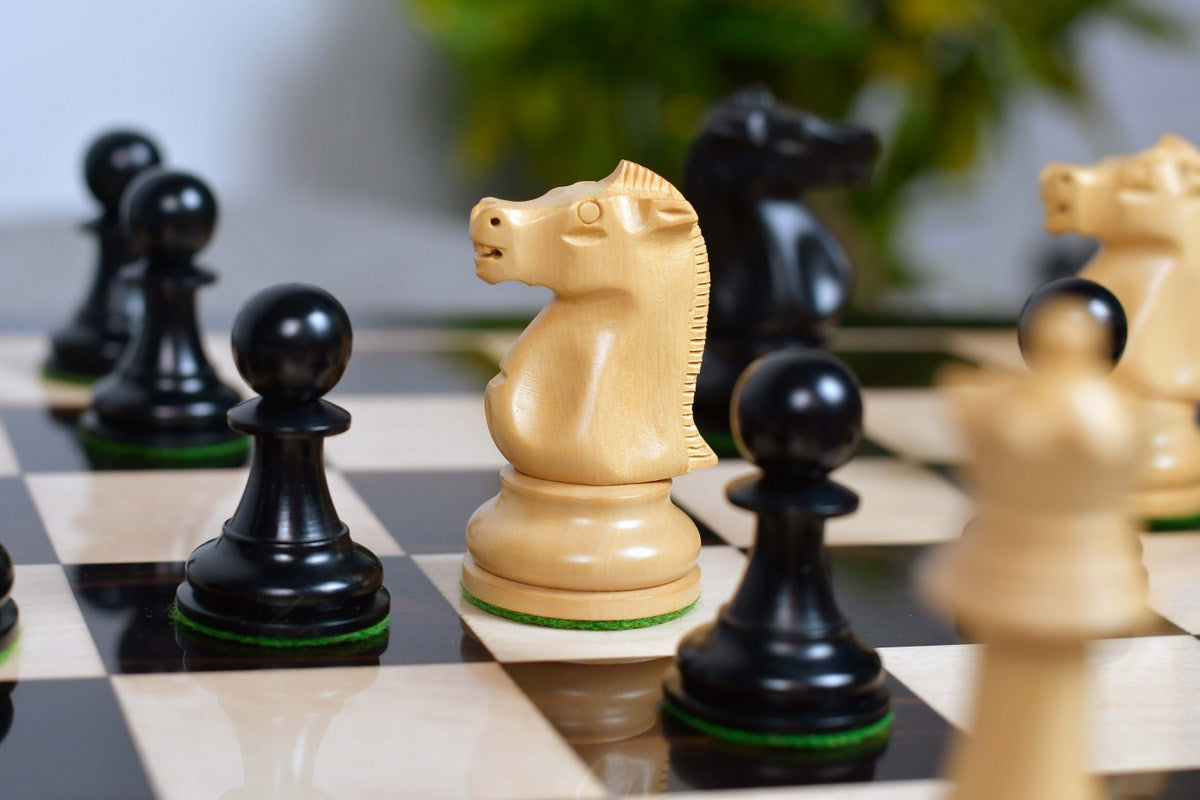Reproduction Fischer Spassky Staunton pieces in natural boxwood, 96mm king