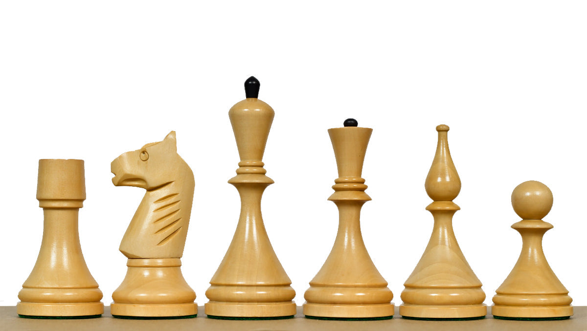 Ebonised chess pieces with a 103mm king and weighted felted bases