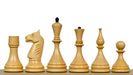 Ebonised chess pieces with a 103mm king and weighted felted bases