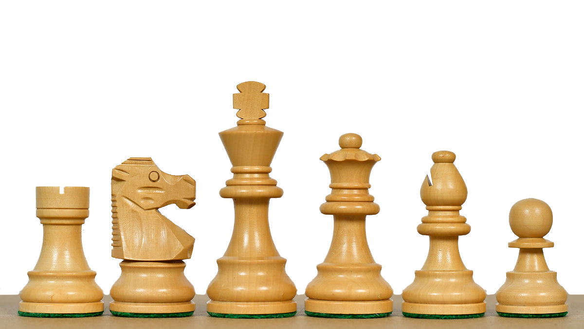Ebonised chess pieces with a 76mm king and weighted felted bases