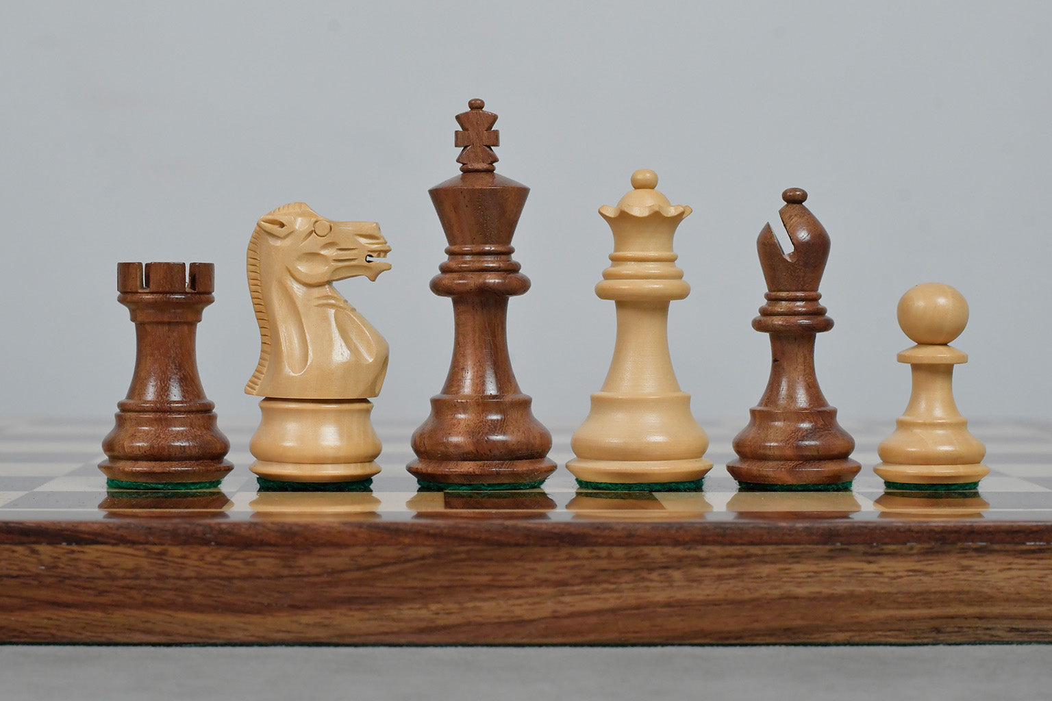 Knight carving detail on the Stallion Weighted Staunton chess set in sheesham and boxwood