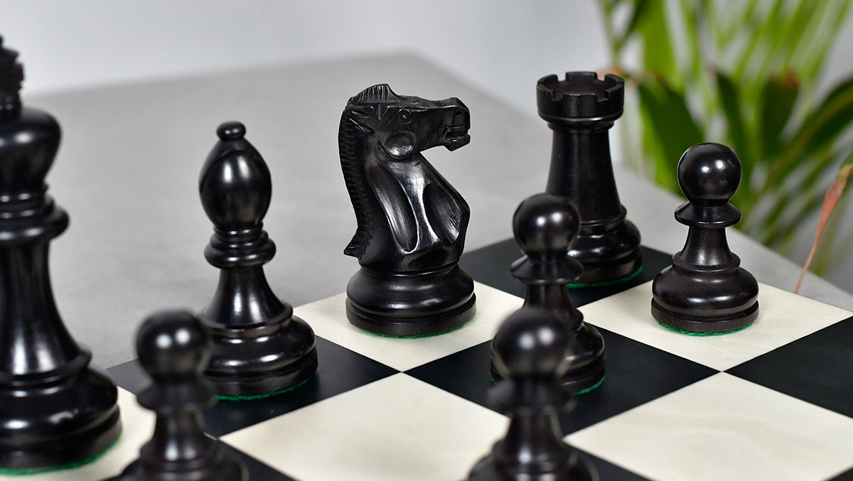 Ebonised boxwood Staunton tournament chess pieces with 43mm king base
