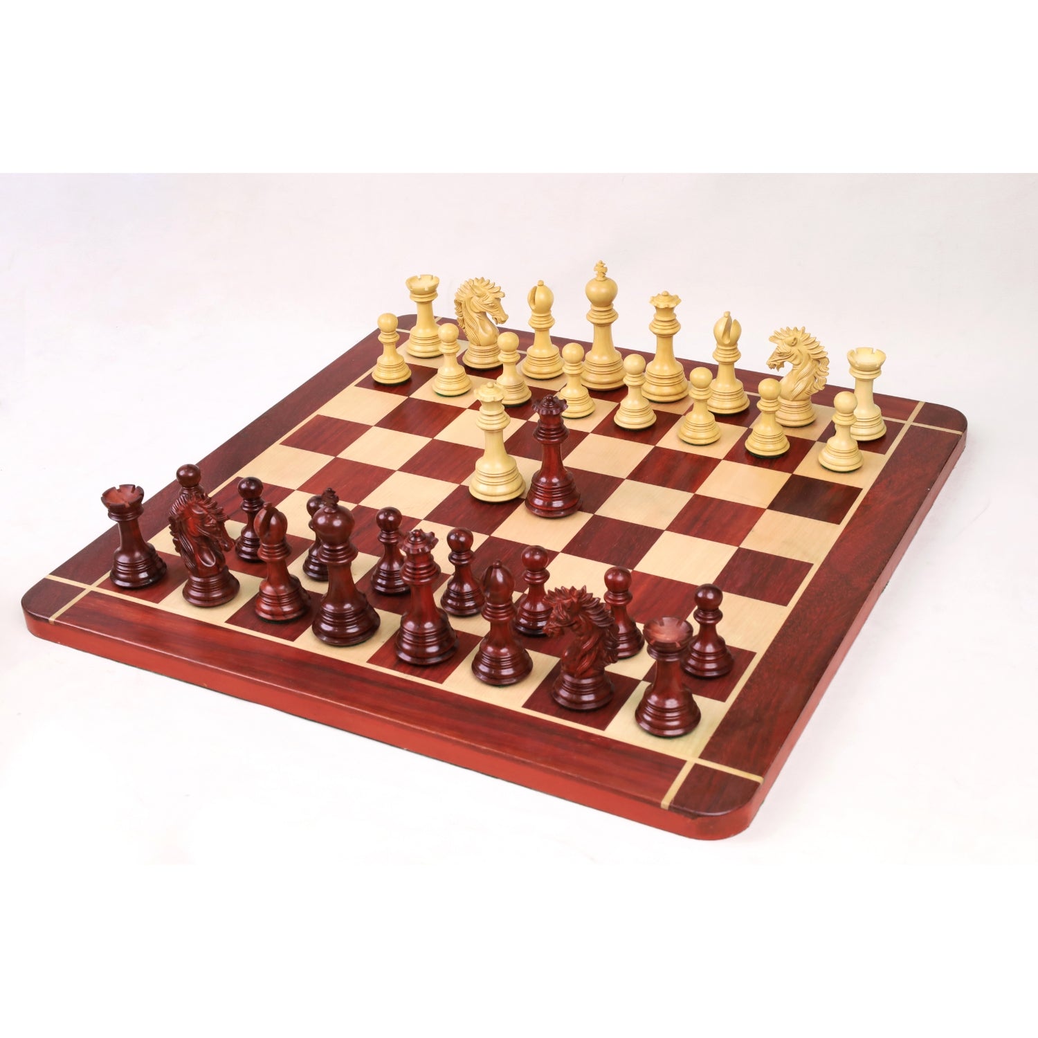 Mogul Staunton chess pieces in bud rosewood, 118mm king