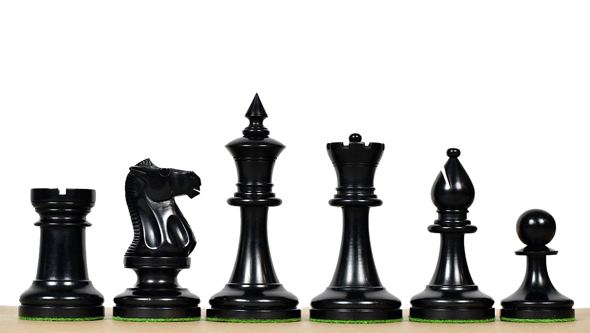 Ebonised chess pieces with a 101mm king and weighted felted bases