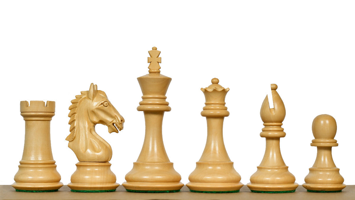 Ebonised chess pieces with a 106mm king and weighted felted bases