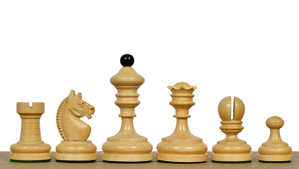 Ebonised chess pieces with a 74mm king and weighted felted bases