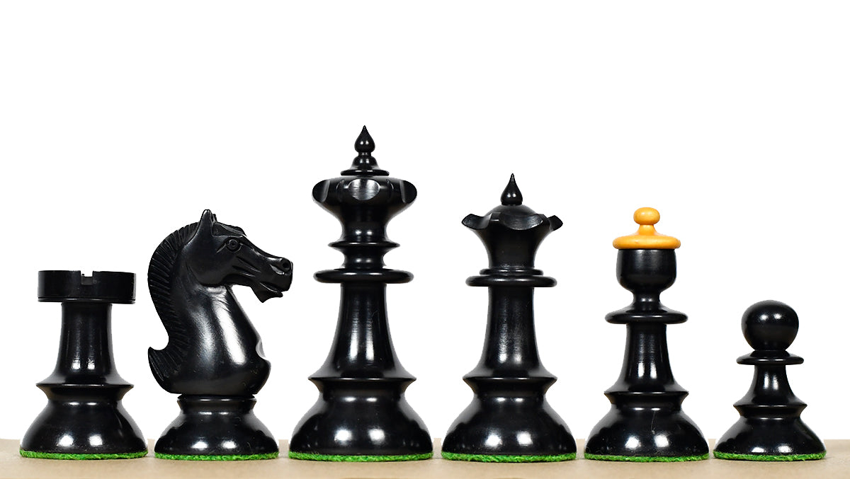 Ebonised chess pieces with a 98mm king and weighted felted bases