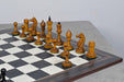 Ebonised chess pieces set up for play on the included 55cm poplar and erable board