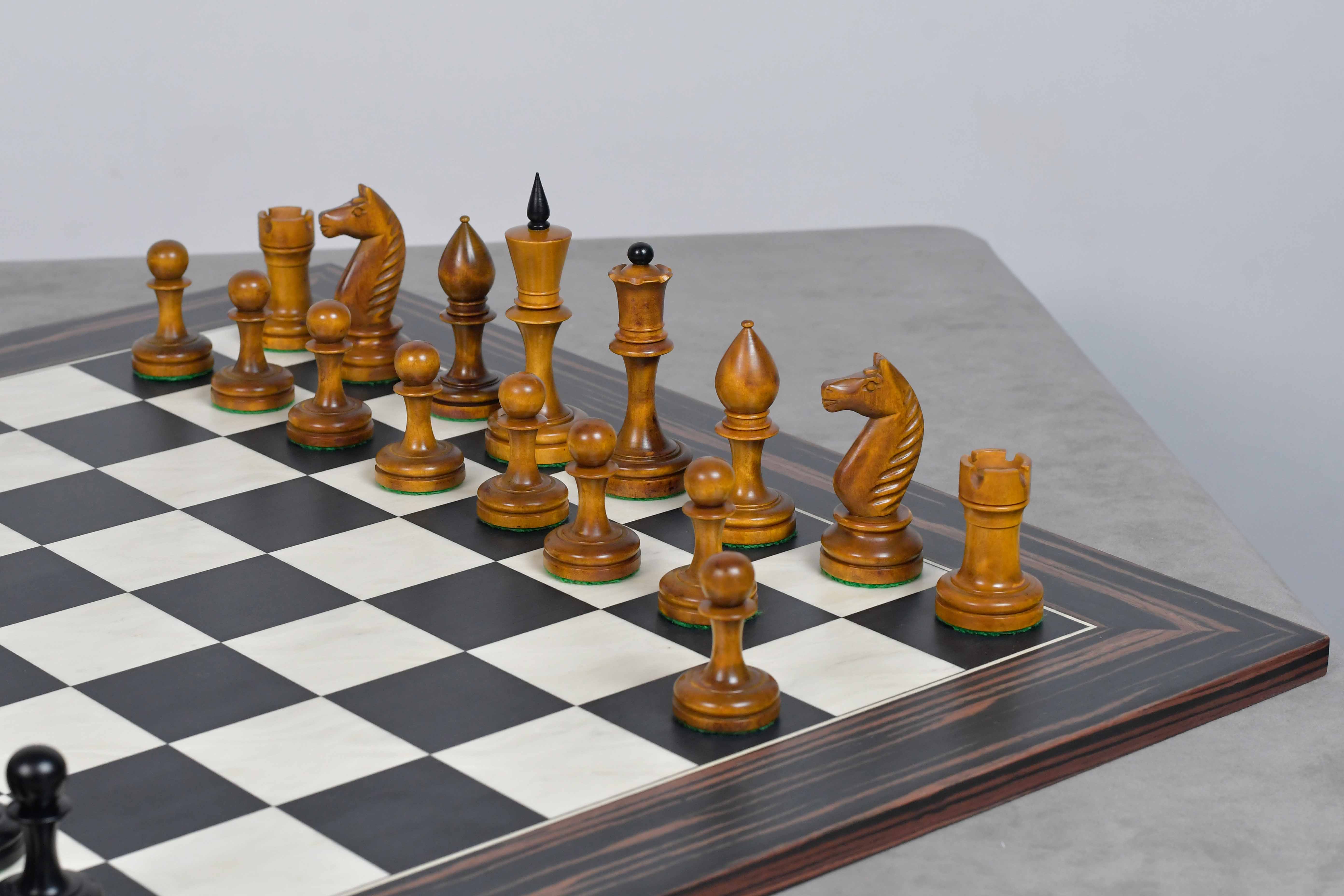 Ebonised chess pieces set up for play on the included 55cm poplar and erable board