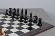 Genuine ebony chess pieces set up for play on the included 55cm poplar and erable board