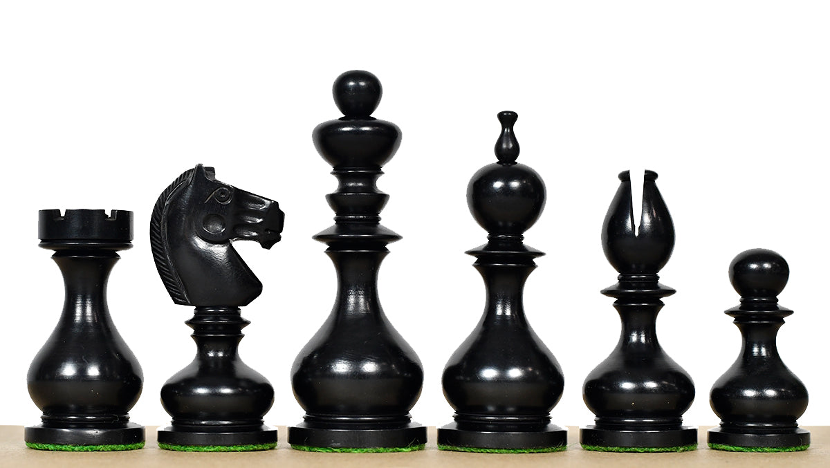 Ebonised chess pieces with a 104mm king and weighted felted bases