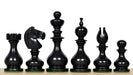 Ebonised chess pieces with a 104mm king and weighted felted bases