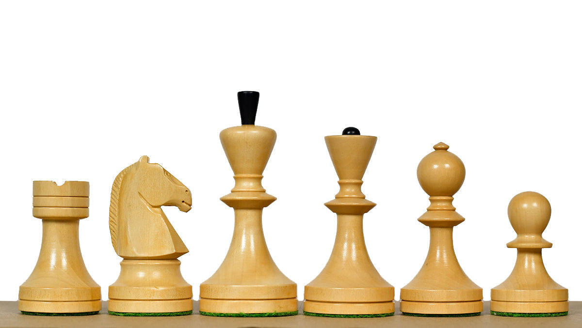 Ebonised chess pieces with a 95mm king and weighted felted bases