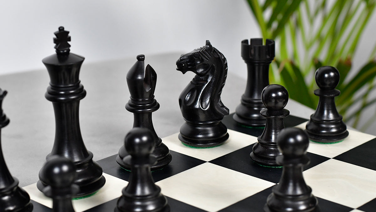 Ebonised Staunton chess pieces with a 103mm king, hand carved in India