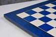 Blue burl chess board showing its 19mm thickness
