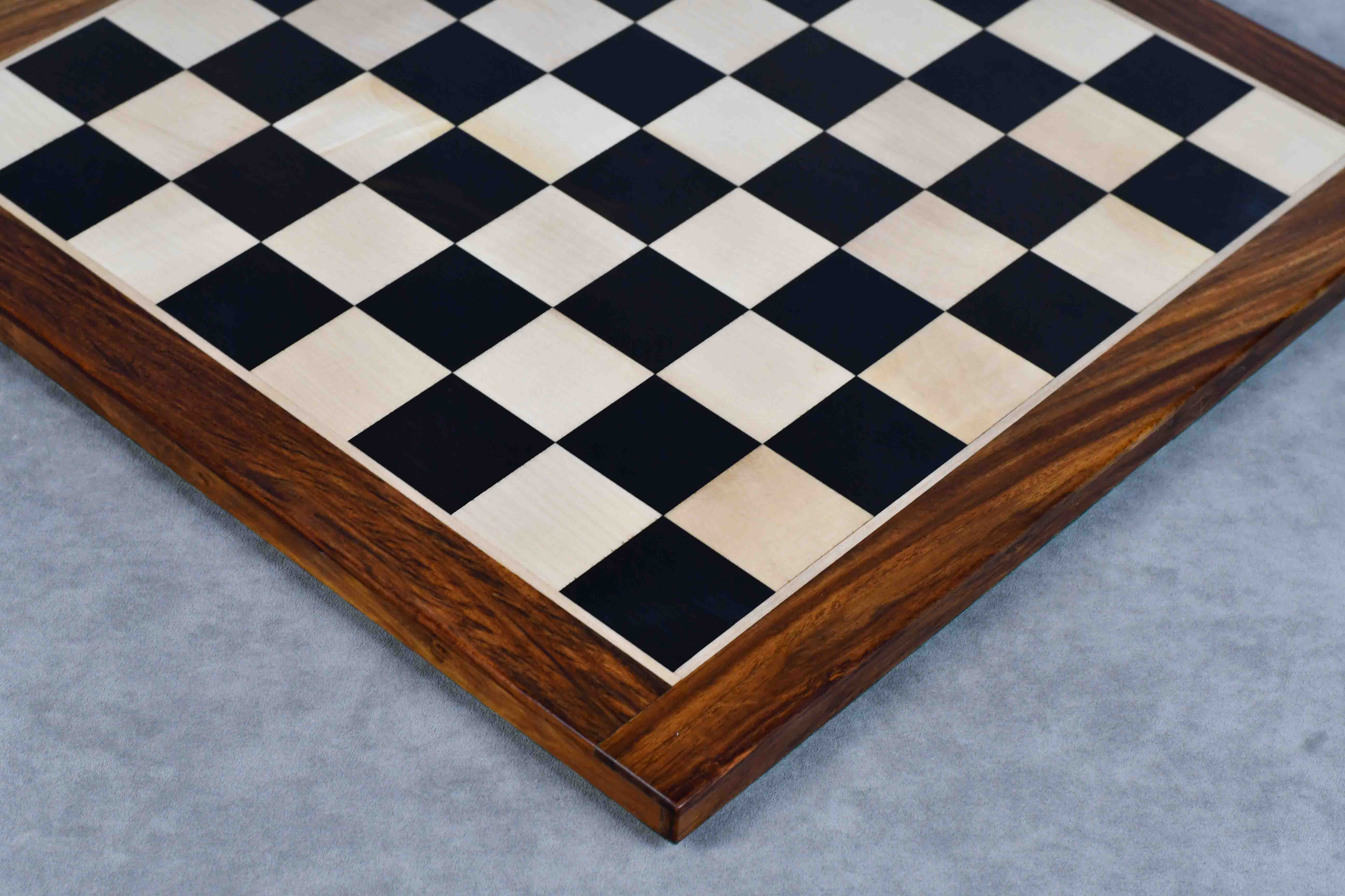 Ebony and maple 17 inch chess board showing its 15mm thickness