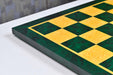 Green burl chess board showing its 19mm thickness