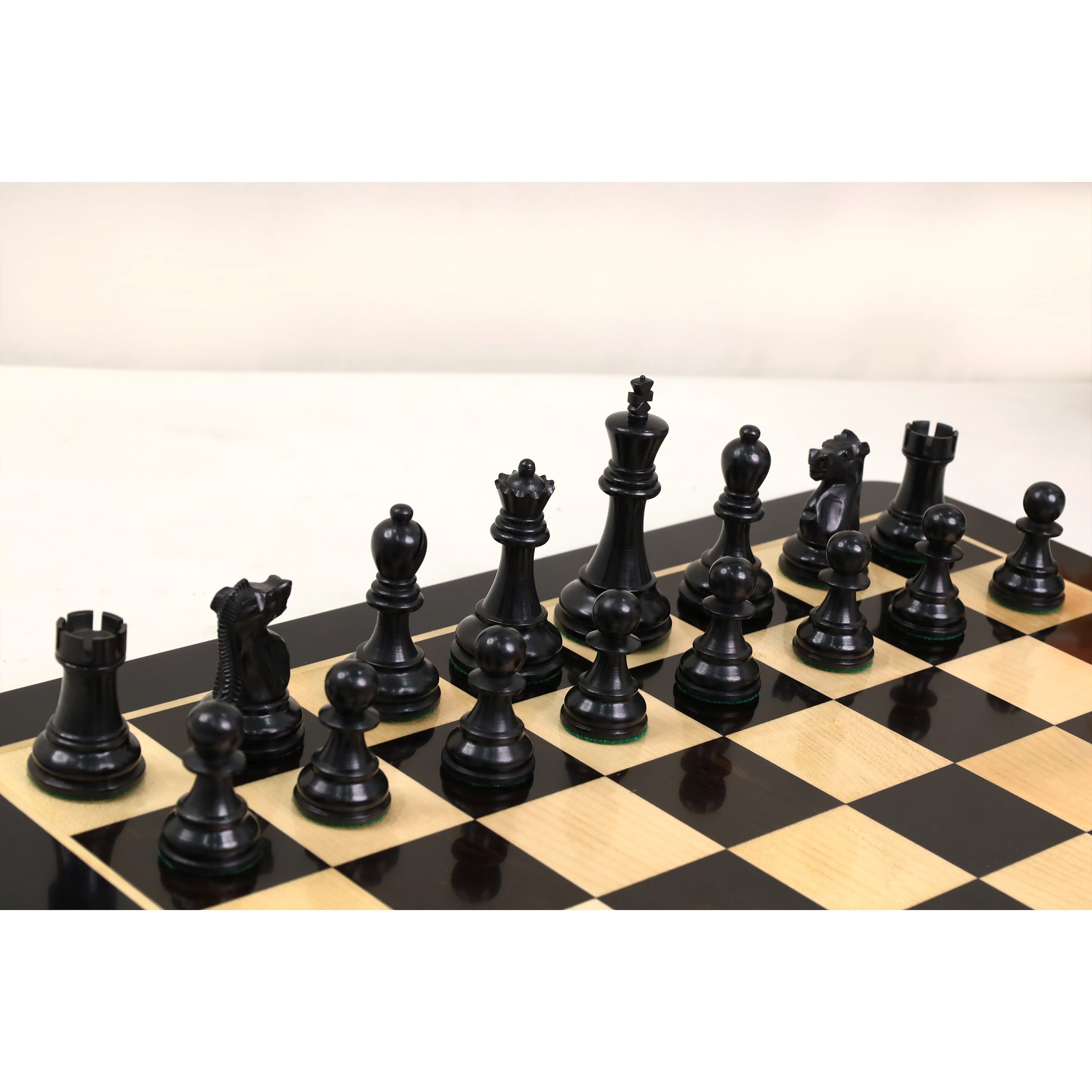 Ebony and Distress Antiqued Boxwood chessmen with a 43mm king base
