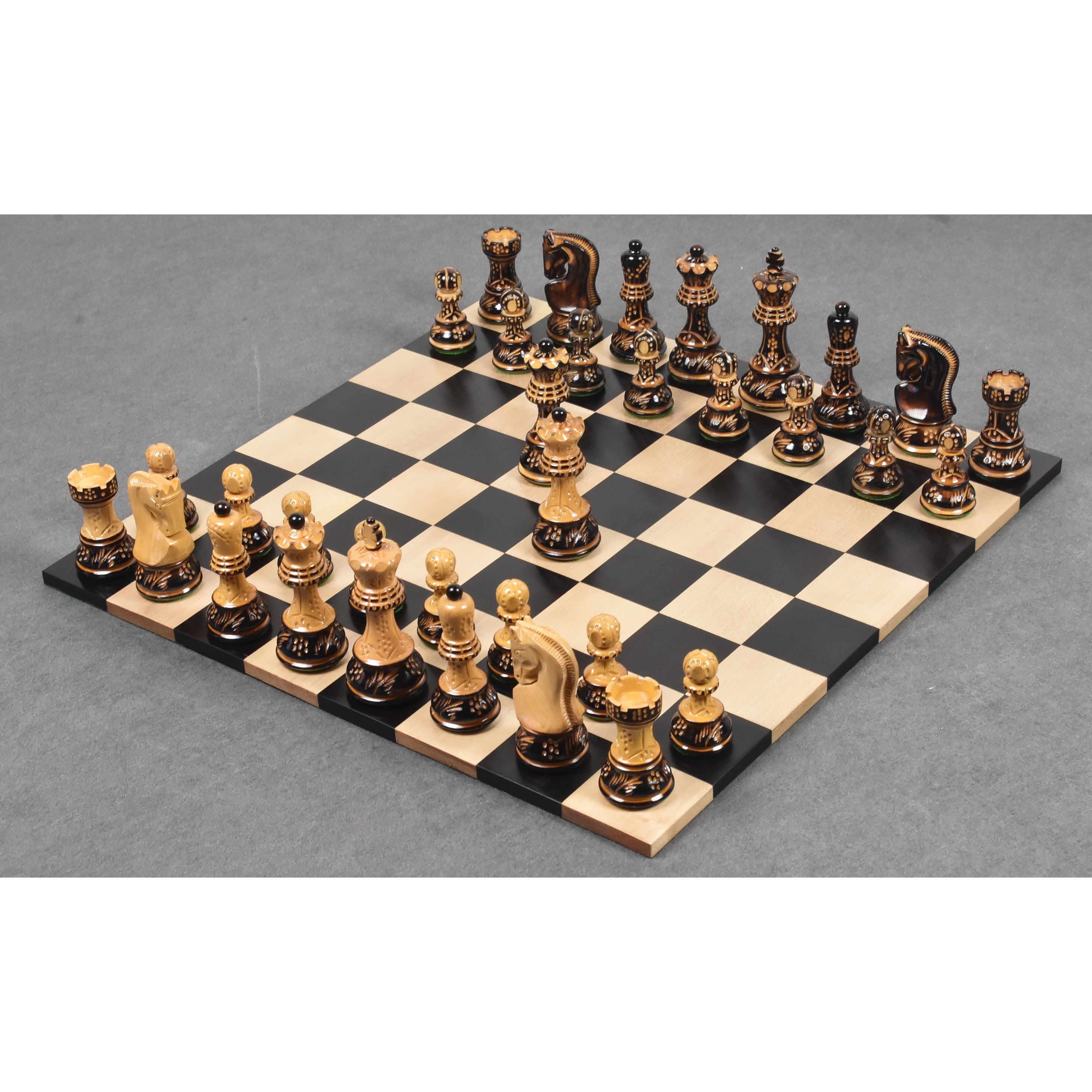 Burnt boxwood Zagreb Staunton chessmen with the light army forward