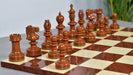 Knight carving detail on the William Hallett chess pieces in golden dyed wood and boxwood