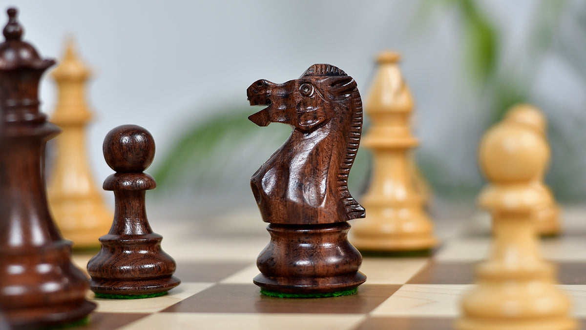 Knight carving detail on the British Staunton Series chess pieces in anjan wood and natural boxwood