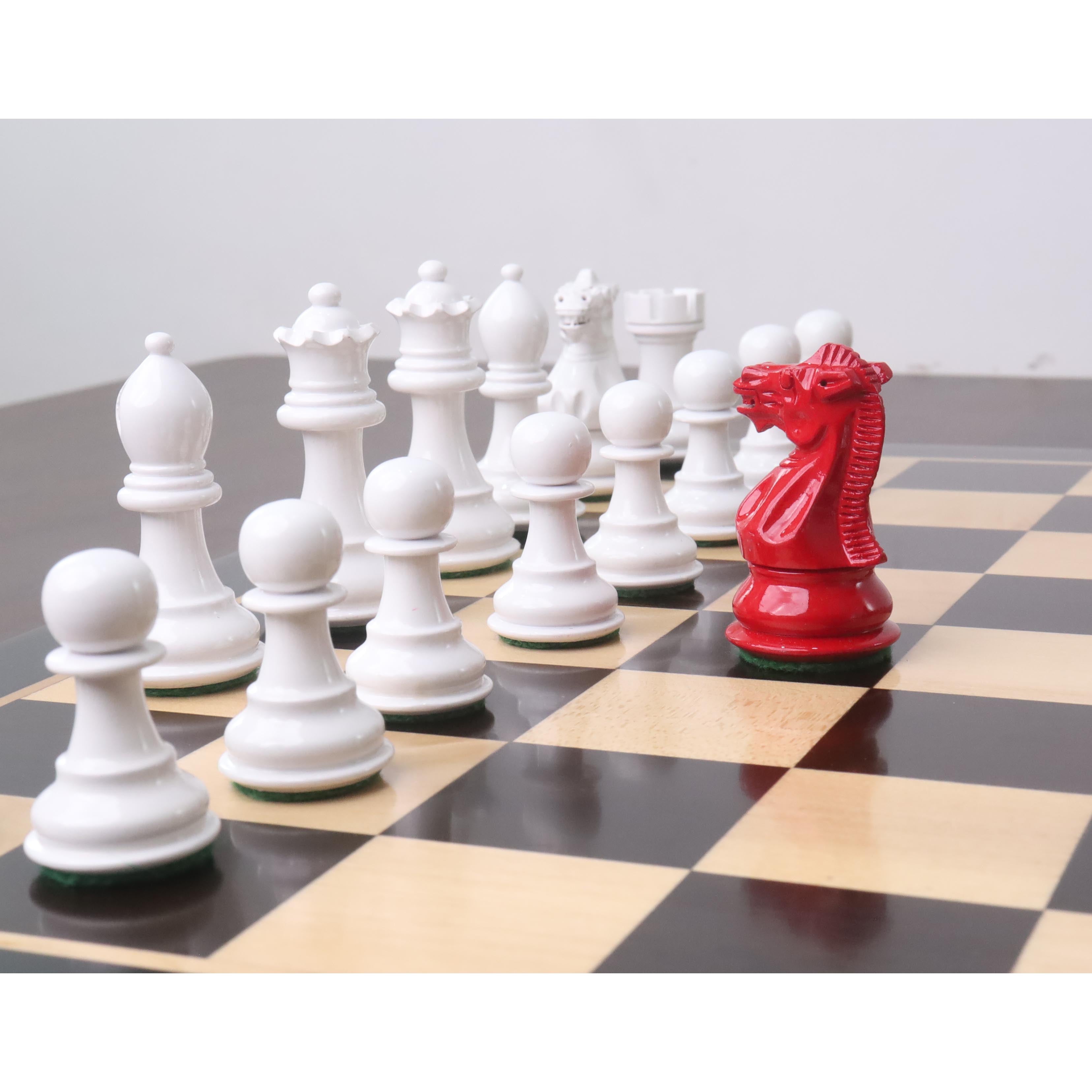 Red Painted Boxwood and White Painted Boxwood chessmen with a 35mm king base