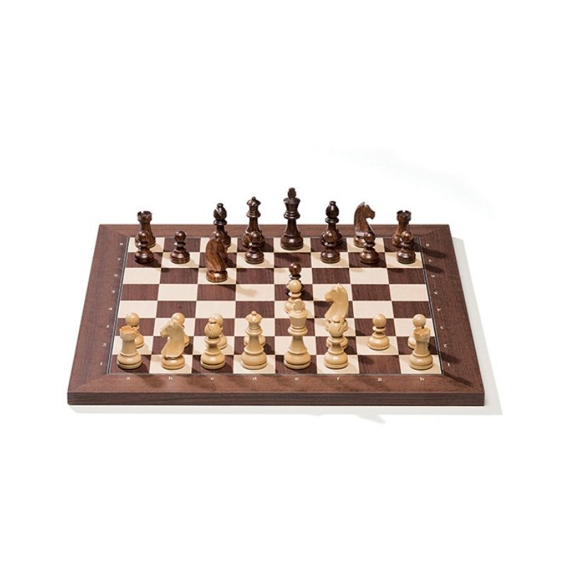 Wooden chessboard with pieces on a white background
