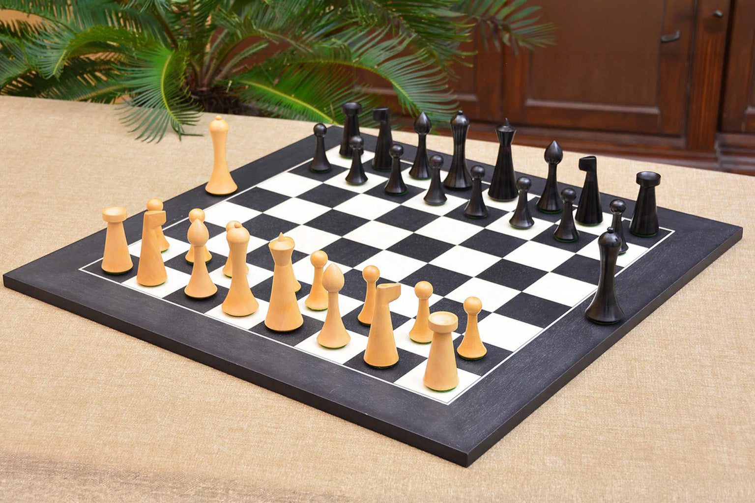 Sterling Chess Hermann Ohme Minimalist chess set in ebonised and boxwood, 95mm king and 45cm board