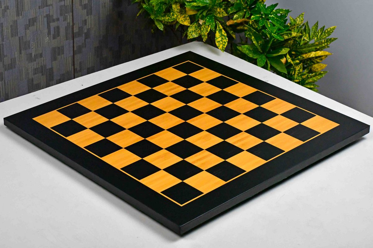 Midnight black and gold tournament chess board photographed from above