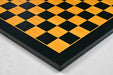 Midnight black and gold chess board, close detail of the surface