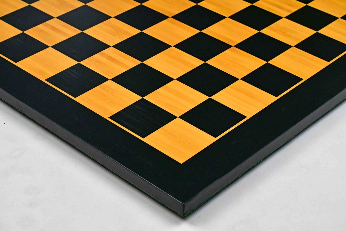 Midnight black and gold chess board, close detail of the surface