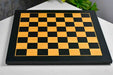 Midnight black and gold tournament chess board at an angle