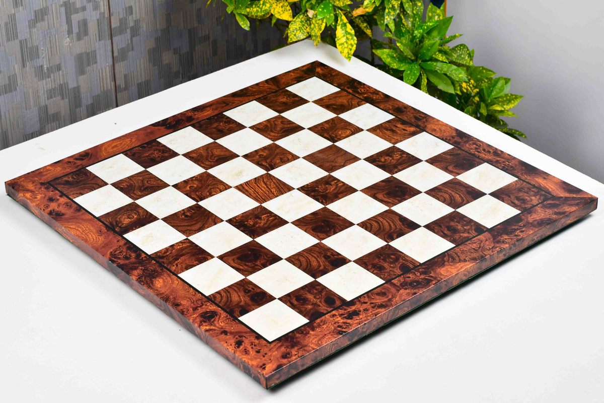 Reddish brown burl grain tournament chess board photographed from above