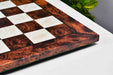 Reddish brown burl grain chess board, close detail of the surface
