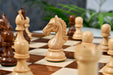 Sheesham chess pieces with a 106mm king and weighted felted bases
