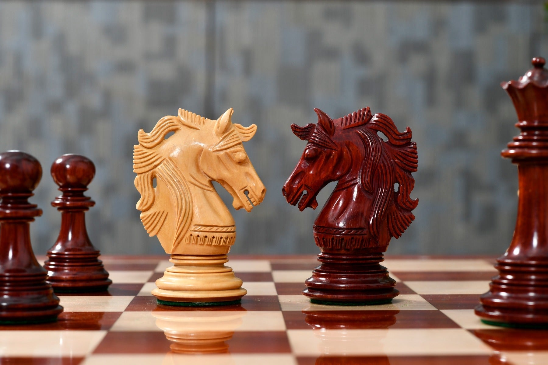 Knight carving detail on the Crown Heritage Series chess pieces in bud rosewood and natural boxwood