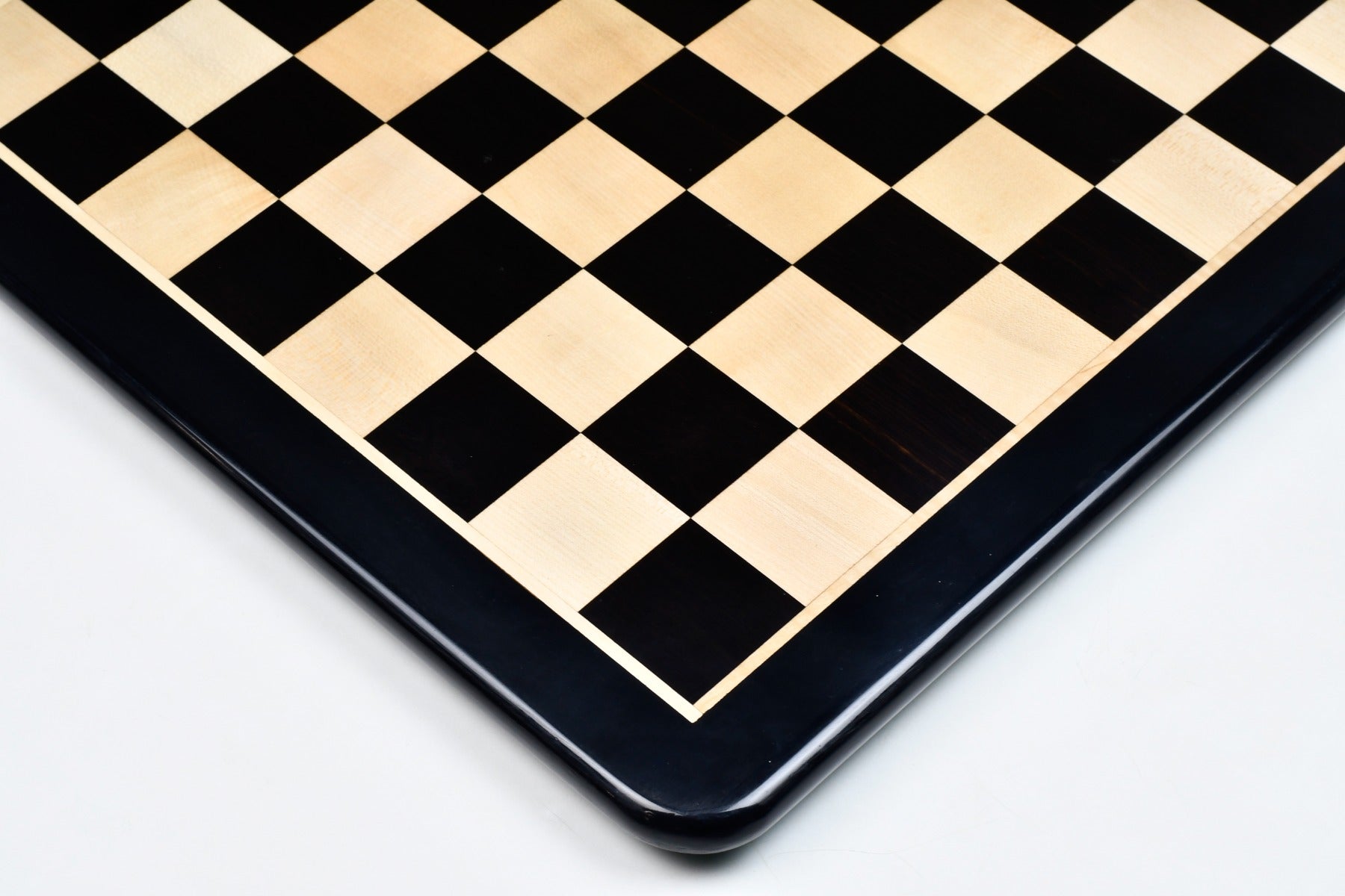 Ebony and maple 21 inch chess board photographed from above