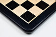 Ebony and maple 55mm square chess board at an angle