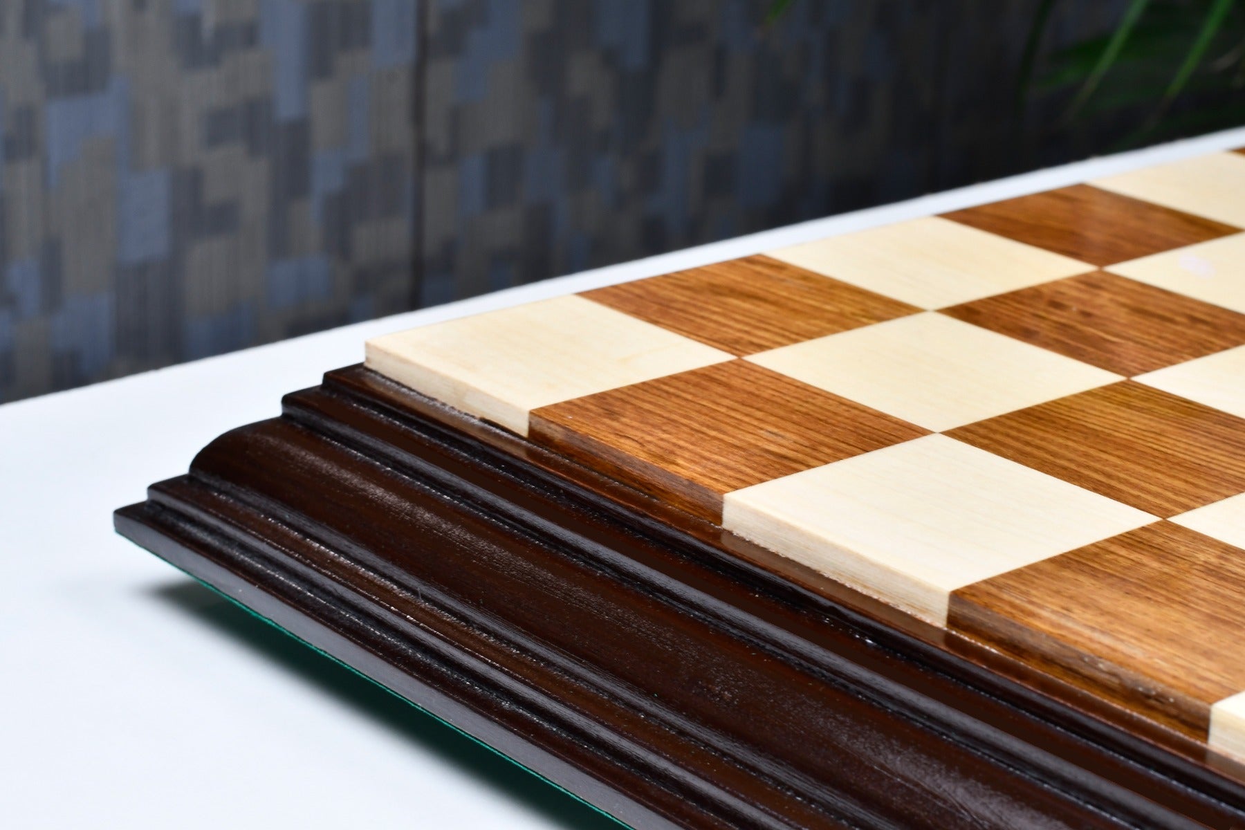 Sheesham and maple 56mm square chess board at an angle