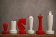 Sterling Chess Berliner Minimalist chess pieces in red and white painted boxwood, 95mm king