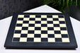 Black anigre and maple chess board at an angle