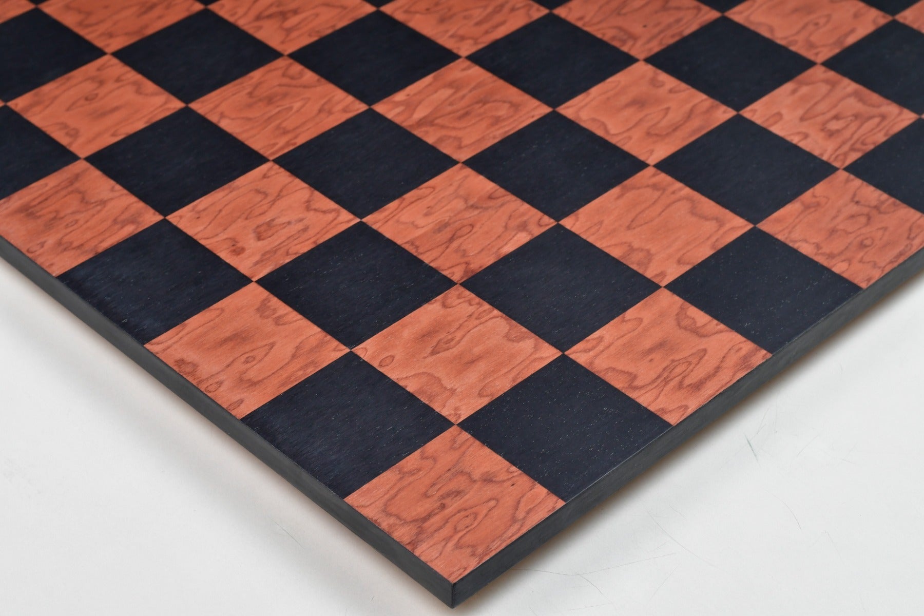 Borderless black anigre chess board photographed from above