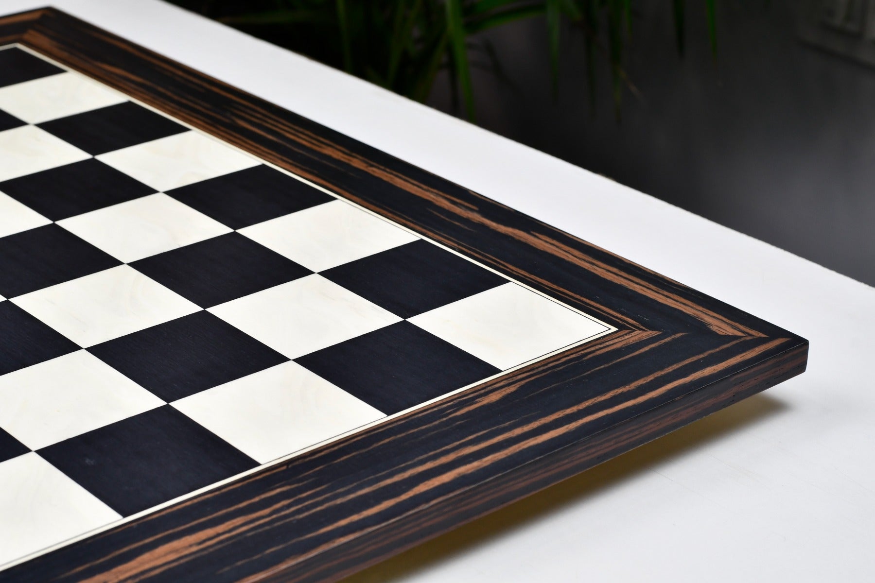 Black dyed poplar and white erable 60cm chess board at an angle