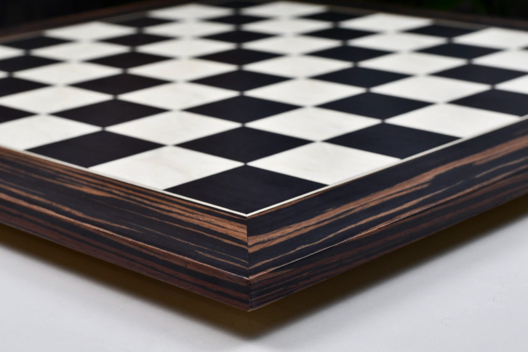 Matte black dyed poplar and white erable 60cm chess board, edge view